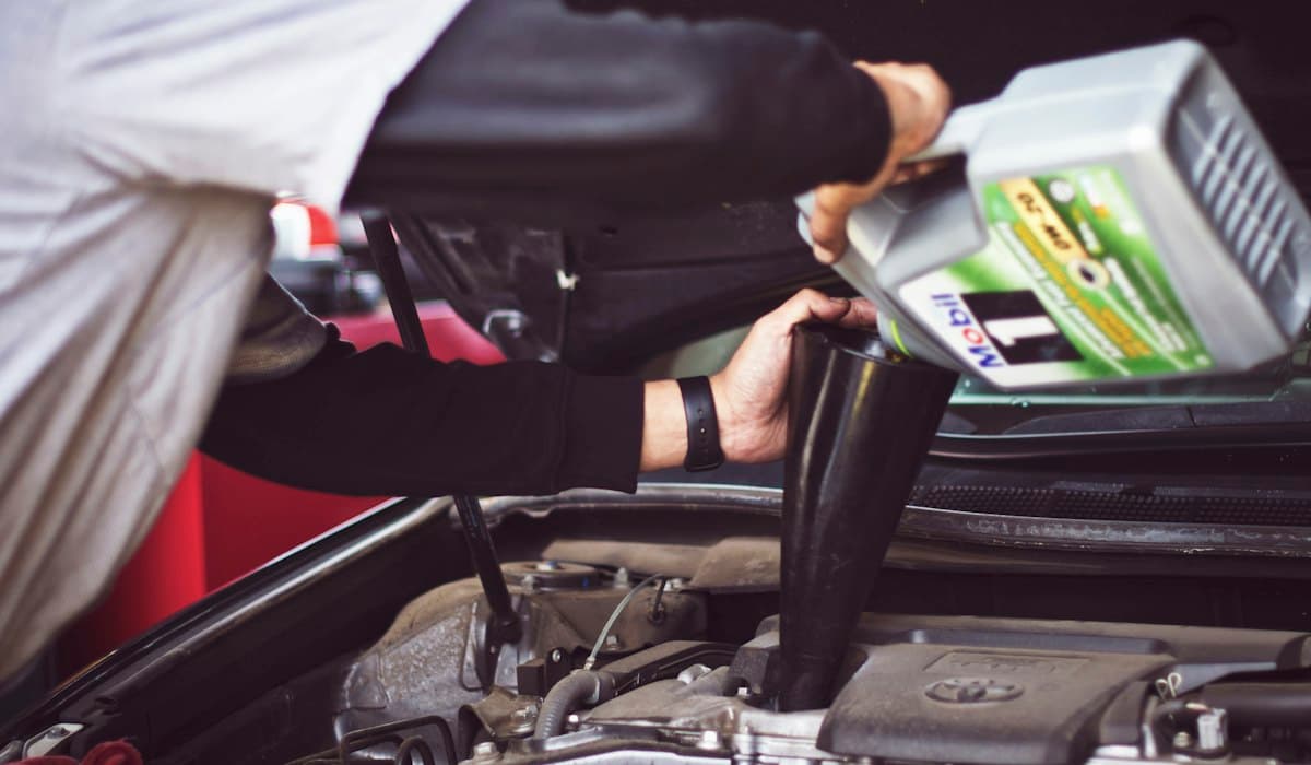 Automotive workshop with engine oil service